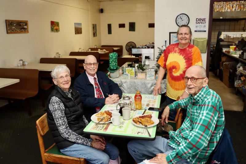 Lemon Tree owner Terry Thomas, standing, talks with longtime customers (l-r) Elaine Pease, Jeff Monaco and Dale Pease March 12. Thomas said she will miss the customers most as she prepares to close the iconic breakfast and lunch spot for good March 19.